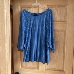 Great top! Chambray color with white stripes. Ruffle detailing on sleeves. W5.